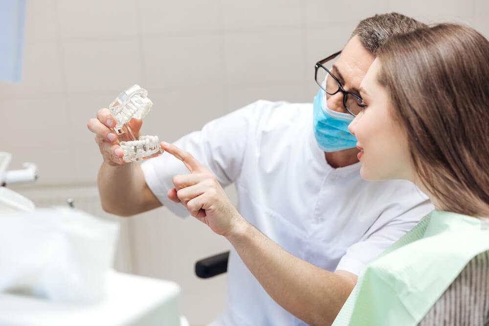Dentist explaining dental implants to a patient