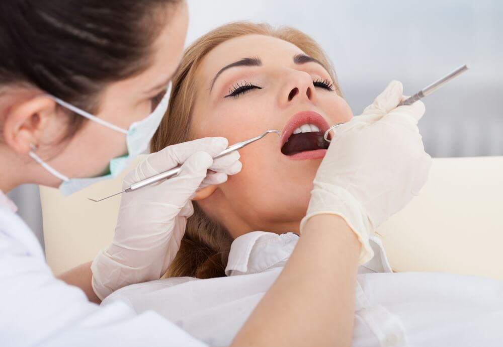 Sedated patient receiving dental care