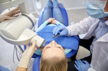 Woman having a dental x ray taken