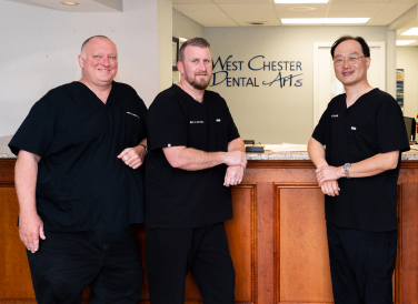 The West Chester Dental Arts team by the front desk