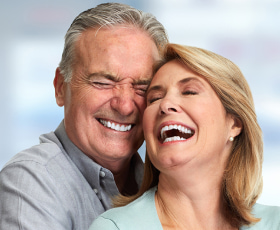 A couple laughing together at West Chester Dental Arts